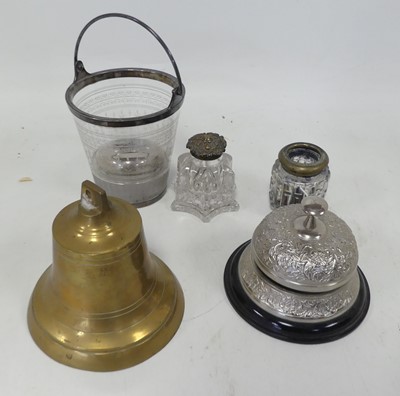Lot 554 - A collection of items to include a brass bell,...