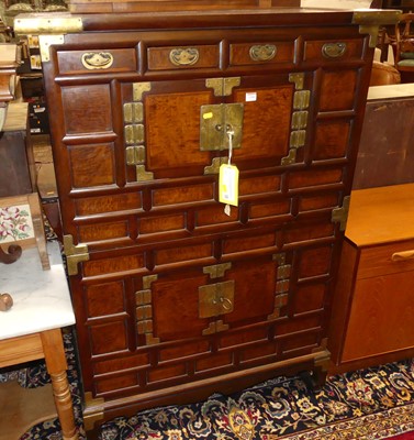 Lot 1346 - An Eastern elm and brass mounted side cabinet,...