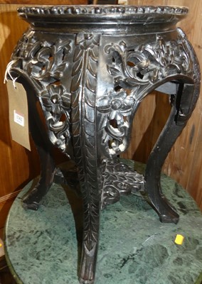 Lot 1362 - A Chinese floral carved, ebonised and rouge...