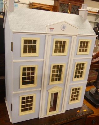 Lot 1387 - A painted three-storey doll's house, in the...