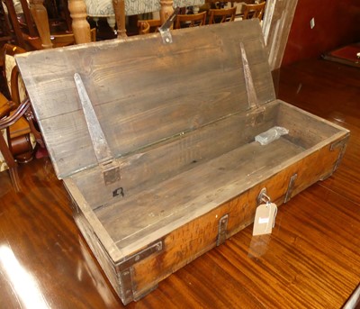 Lot 1402 - A stained pine and iron bound hinge top trunk,...
