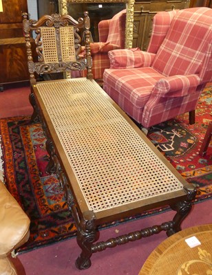 Lot 1430 - A walnut and cane inset daybed, length 175cm