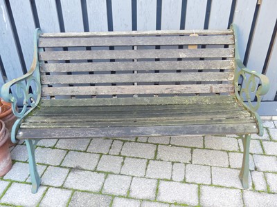 Lot 1493 - A cast iron ended and teak slatted two-seater...