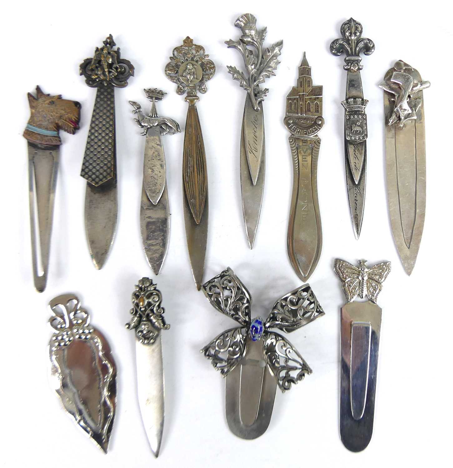 Lot 33 - A collection of white metal decoratively...