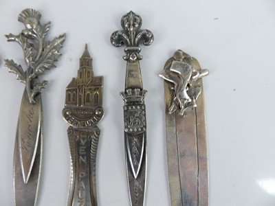 Lot 33 - A collection of white metal decoratively...