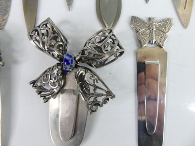 Lot 33 - A collection of white metal decoratively...