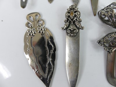 Lot 33 - A collection of white metal decoratively...