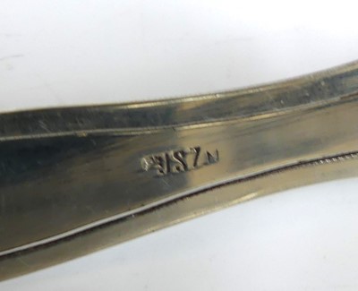 Lot 33 - A collection of white metal decoratively...