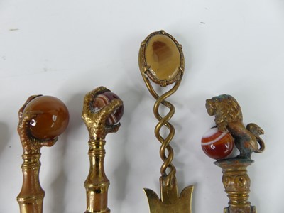 Lot 58 - A collection of Victorian hardstone topped...