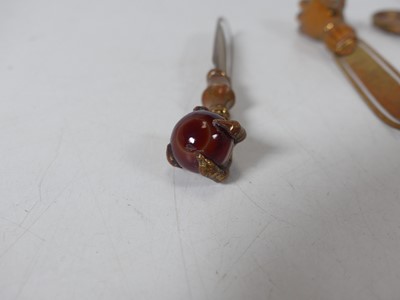 Lot 58 - A collection of Victorian hardstone topped...