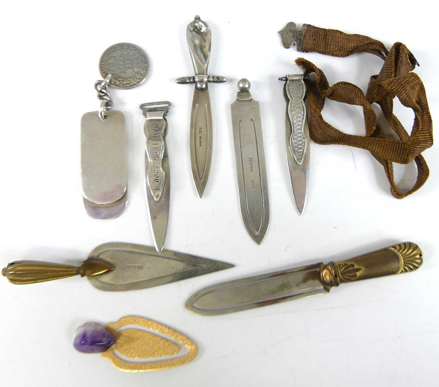 Lot 57 - Five early 20th century silver clip bookmarks,...