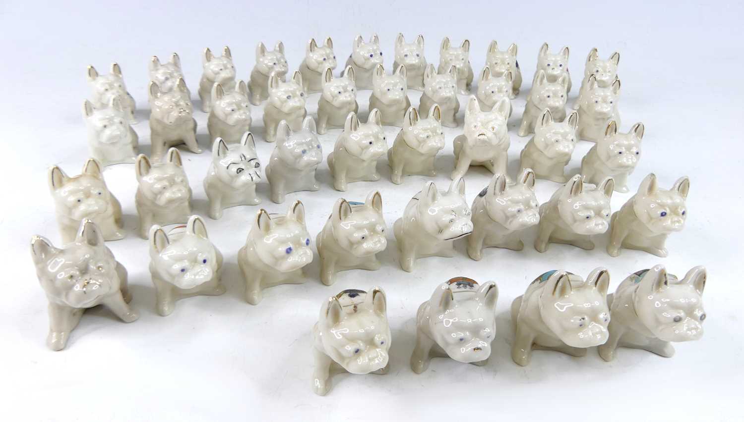 Lot 44 - A collection of various crested china seated...