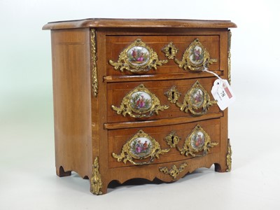 Lot 78 - A reproduction French walnut table chest, of...
