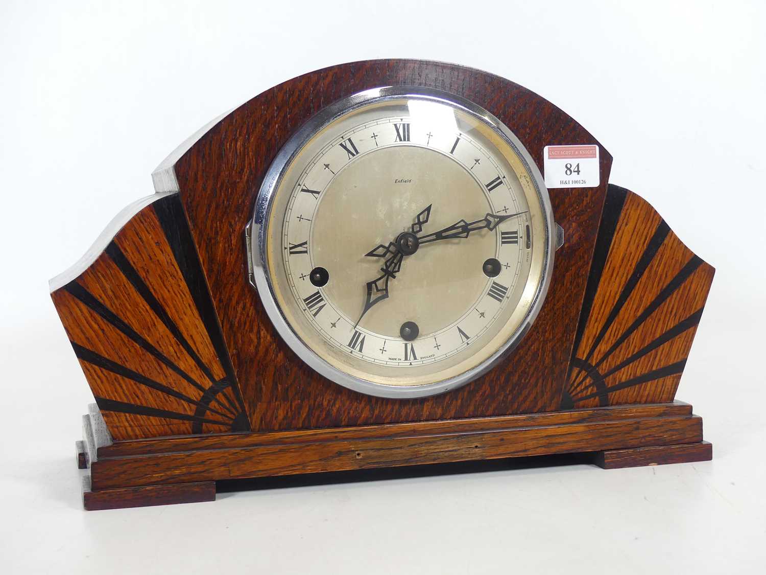 Lot 84 - An Art Deco oak cased mantel clock of fanned...