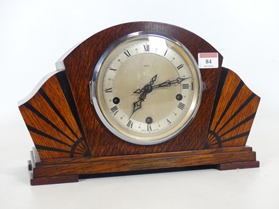 Lot 84 - An Art Deco oak cased mantel clock of fanned...