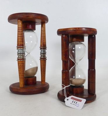 Lot 111 - A stained wood and glass hourglass, h.23cm;...