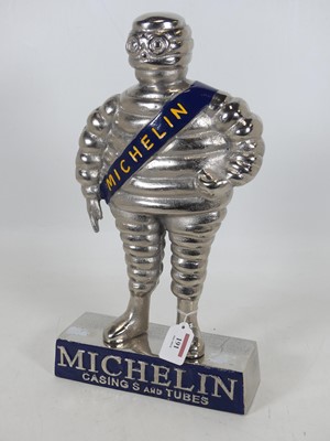 Lot 191 - A chromed metal model of the Michelin Man,...