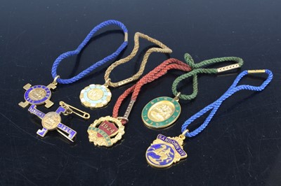 Lot 1233 - A collection of base metal and enamel Sandown...