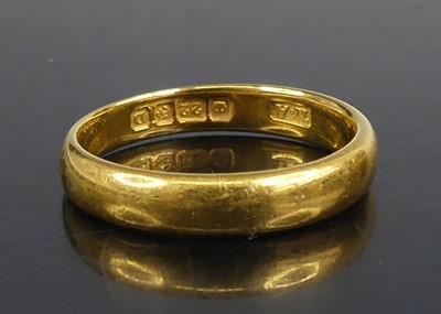 Lot 2584 - A 22ct gold 3.5mm court shaped wedding band,...