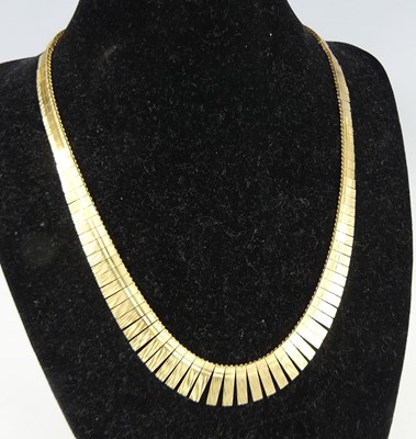 Lot 2588 - A modern 9ct textured yellow gold fringe...