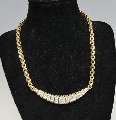 Lot 2218 - An 18ct yellow gold diamond necklet, having...