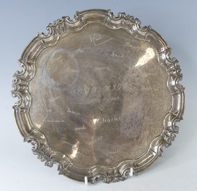 Lot 2140 - An Edwardian silver salver, having wavy...