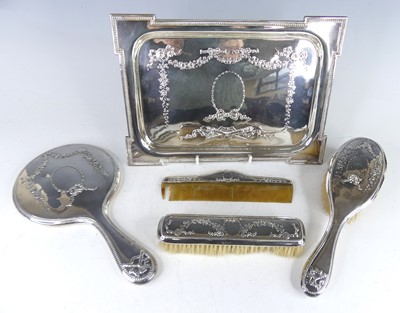 Lot 2111 - An Edwardian silver five-piece dressing table...