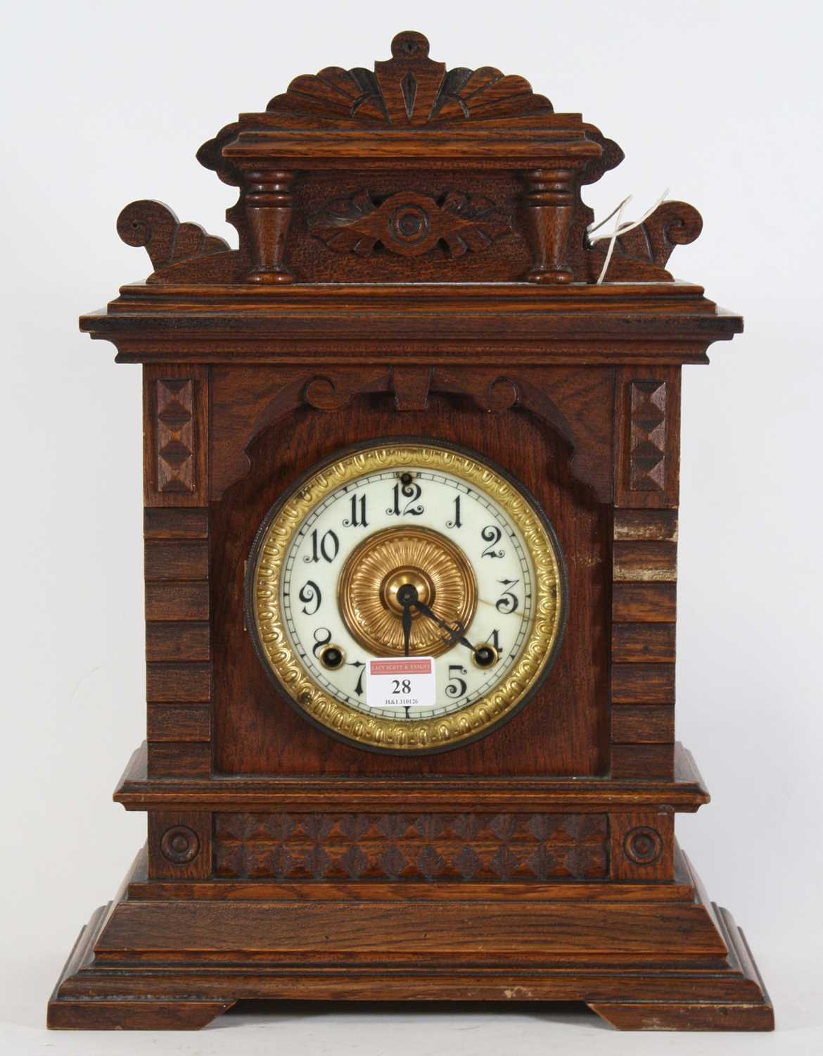 Lot 28 - A late 19th century American oak cased mantel...
