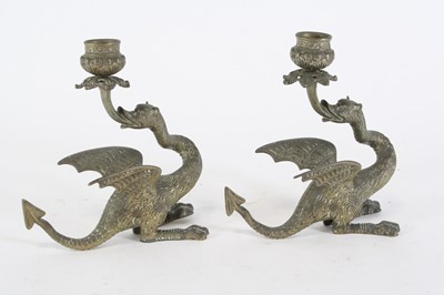 Lot 34 - A pair of brass table candlesticks in the form...