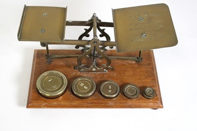 Lot 47 - A set of late 19th century brass postal scales,...