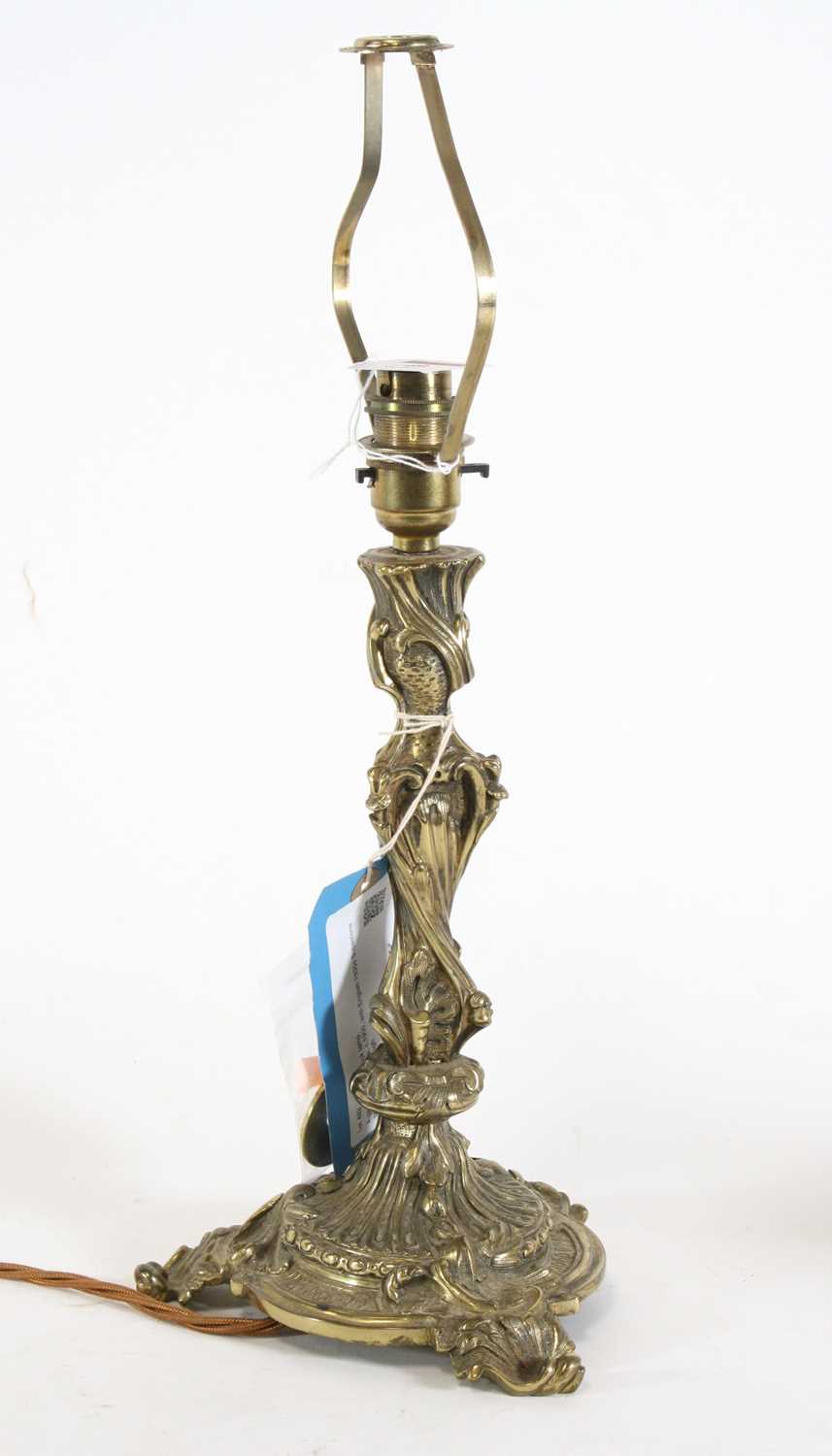 Lot 49 - A French polished brass table lamp in the...