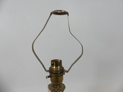 Lot 49 - A French polished brass table lamp in the...