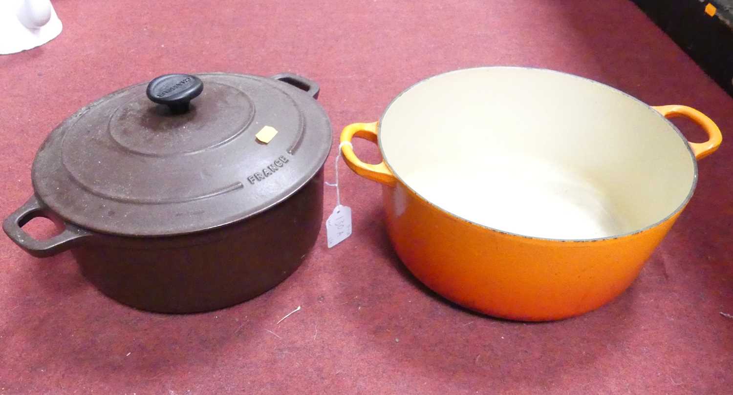 Lot 130 - A Le Creuset orange enamelled cast iron...