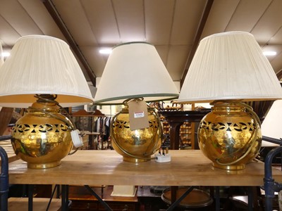 Lot 1165 - *A set of three hammered and pierced brass...
