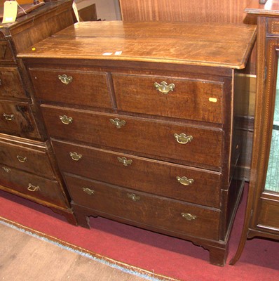 Lot 1208 - A circa 1800 provincial oak chest of two short...
