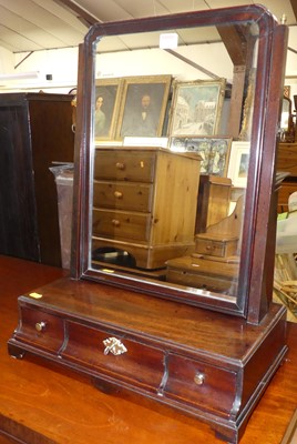 Lot 1219 - A George III mahogany swing dressing mirror,...