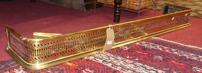 Lot 1268 - A late Victorian pierced brass kerb fire...