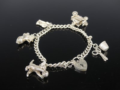 Lot 417 - A modern silver charm bracelet, 24g