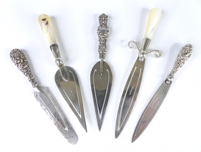 Lot 386 - A collection of silver and white metal clip...