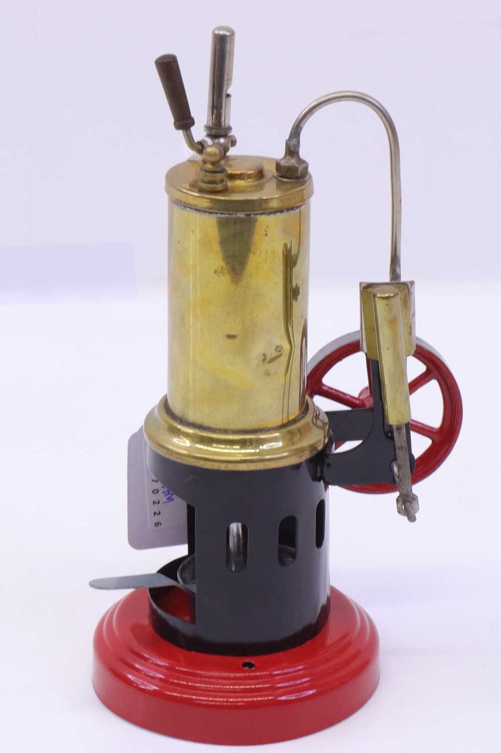 Lot 12 - Tinplate vertical spirit-fired live steam...