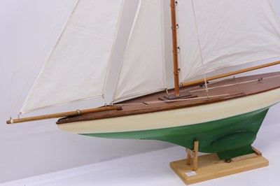 Lot 57 - A carved wooden hull pond yacht, with canvas...