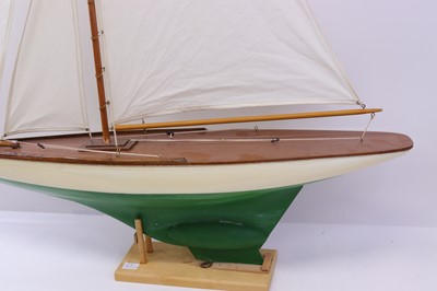 Lot 57 - A carved wooden hull pond yacht, with canvas...