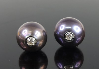 Lot 2180 - A pair of white, dyed black cultured...