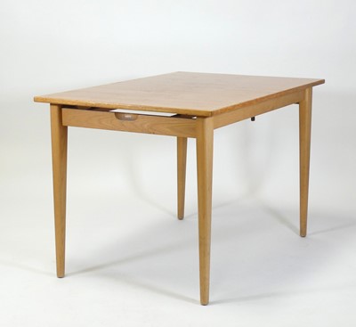 Lot 408 - A 1960s teak extending dining table, having a...