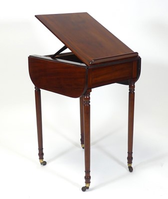 Lot 2458 - A Regency mahogany writing table, having a...