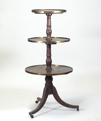Lot 2429 - A Regency mahogany three-tier dumb waiter, the...