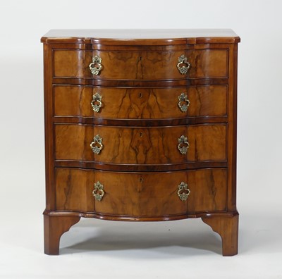 Lot 2471 - A walnut and figured walnut chest in the...