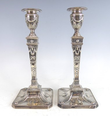 Lot 2139 - A pair of late Victorian silver candlesticks...