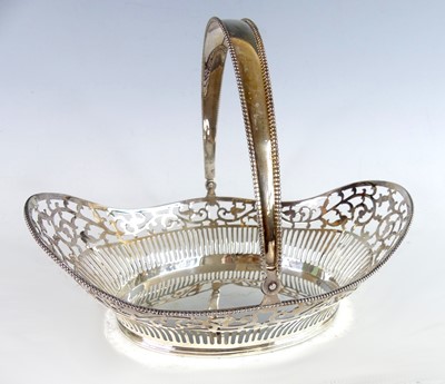 Lot 2133 - A late 20th century silver swing handled table...