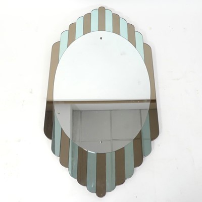 Lot 398 - An Art Deco shaped wall mirror, the oval plate...
